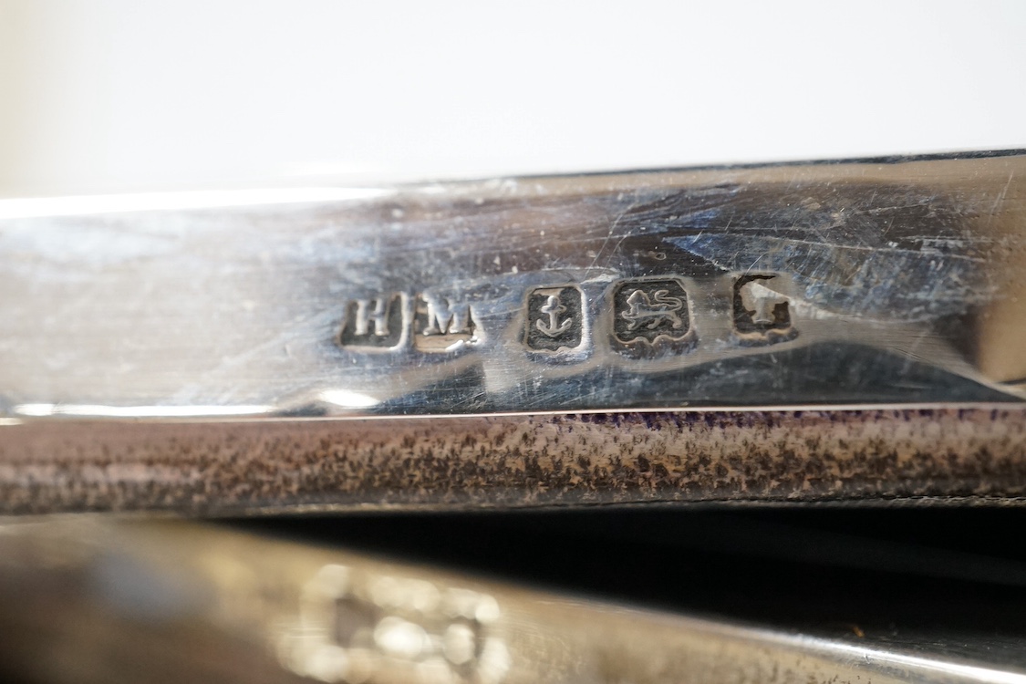 Three assorted early 20th century silver mounted photograph frames, including Birmingham, 1916, (some marks rubbed), largest 27cm. Condition - poor to fair